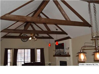 Dramatic cedar beams give the living room a unique