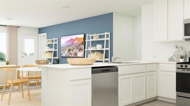 Kitchen featuring kitchen peninsula, appliances wi