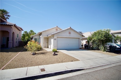 View of front of property featuring a garage, conc