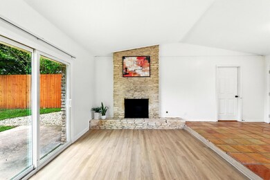 Unfurnished living room featuring lofted ceiling,