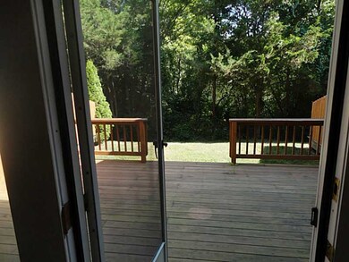 Exterior Back. VIEW OF DECK FROM LIVINGROOM