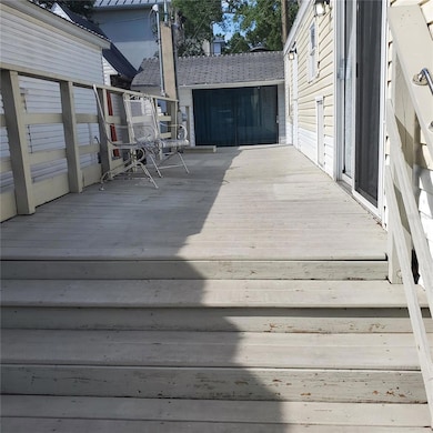 Long deck leading to entry and storage shed