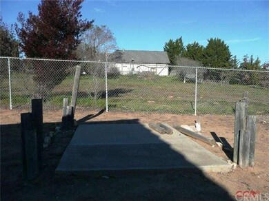 Concrete slab with water spigot could be a horse w