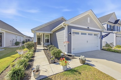 Craftsman inspired home featuring concrete driveway and a garage