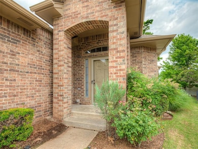 Entrance to property featuring brick siding