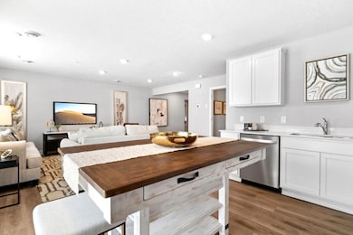 Open concept living with many ways to arrange furniture. Photo is of model home. Colors and options may vary. Ask Sales Agent for details.