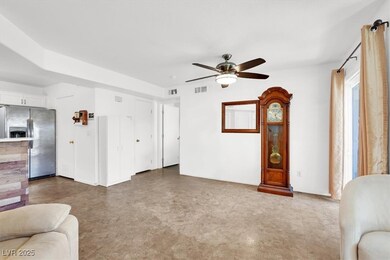 Living room featuring visible vents, tile patterne