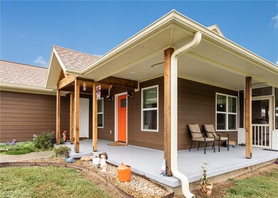 Beautiful front porch with cedar poles and covered