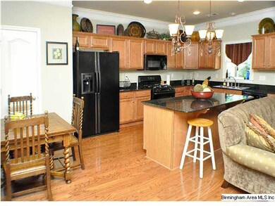 Nice eat-in Kitchen features black appliances, bla