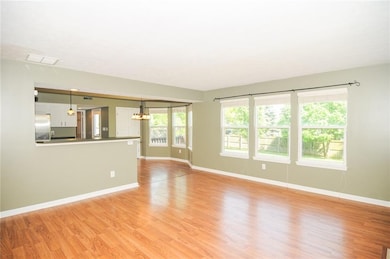 Perfect breakfast bar is the only separation between the living room and the kitchen.
