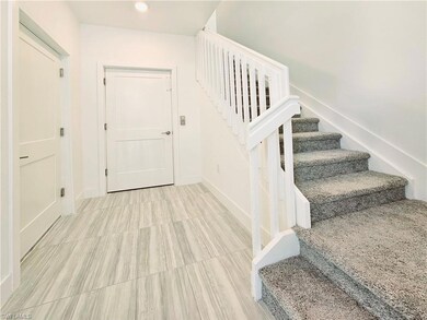Stairs featuring baseboards and recessed lighting