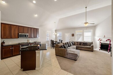 Kitchen featuring lofted ceiling, a center island 