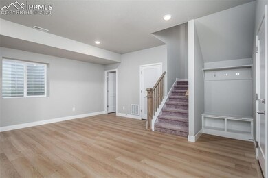 Basement featuring light hardwood / wood-style flo