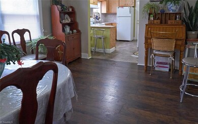 Spacious dining room with beautiful laminate floors.