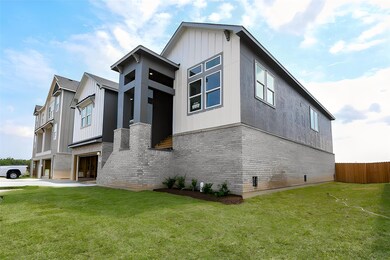 Notice this gorgeous facade with brick and siding