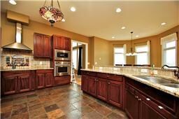 Stainless Appliances, Granite Counters and Beautiful Slate for the flooring.  Wonderful light.