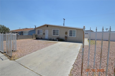 Ranch-style house with driveway and stucco siding