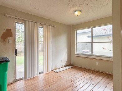 The breakfast area is adjacent to the kitchen and has a sliding door to the backyard.