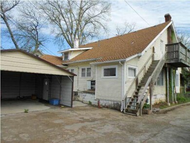 BACK OF THE HOME AND CAR PORT