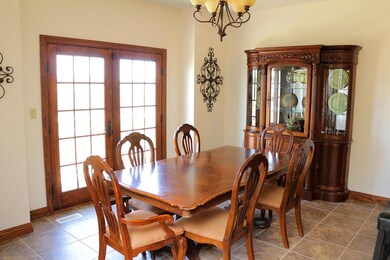 Dining Area w/ Doors to Deck