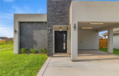 Doorway to property featuring a yard