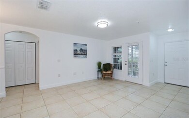 Living room with Tile floor and access to Patio
