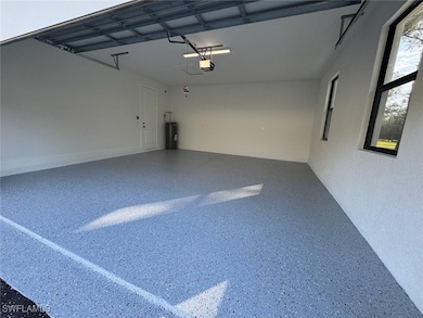 Garage with a garage door opener and water heater