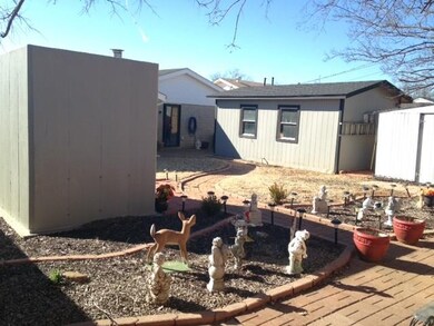 Large yard view from back of lot with Shop and Sto