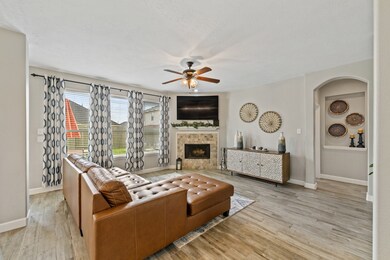 A great space to entertain in, or just hang out.  This downstairs living room features a wood fireplace for all those incredibly cozy nights in!