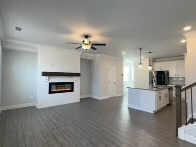 Kitchen with open floor plan, stainless steel dish