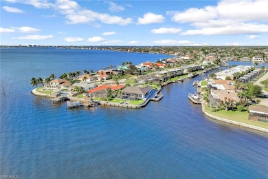 Birds eye view of property with a water view and a
