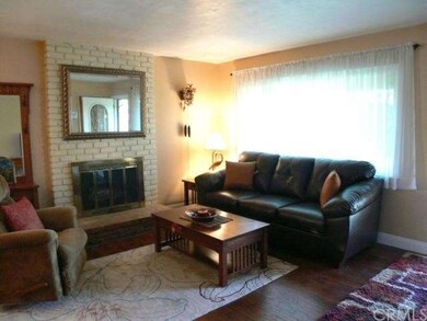 Alternate view of living room with brand new floor
