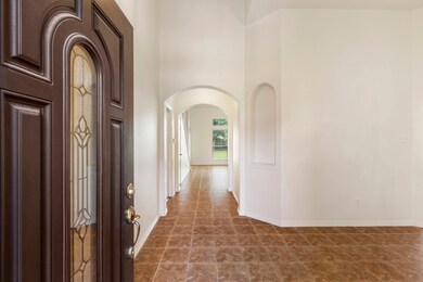 Walk into the front door, you are greeted with high ceilings and beautiful arches.