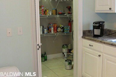 Walk-in pantry has washer dryer hook ups for downs