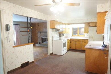 View of the eat-in Kitchen from the back patio wit