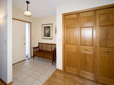 Inviting foyer with a ceramic tile floor & double 