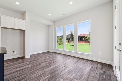 Unfurnished living room featuring dark wood-style