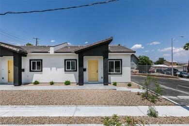 View of front facade featuring stucco siding, a ti