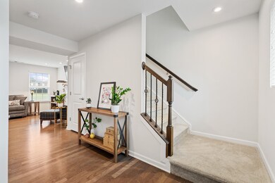 Neutral hardwood floors through out the first floor of this two story home. 
