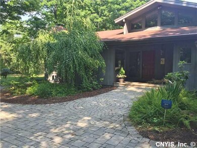 Exterior Front. Stunning horseshoe paver driveway 