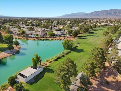 Aerial perspective of suburban area with a water a