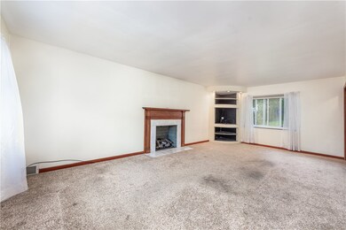 Large living room with gas fireplace.