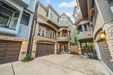 Modern multi-story townhouse with a two-car garage