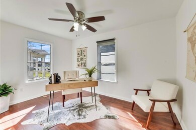 Home office with wood finished floors and ceiling