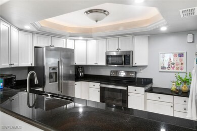 Kitchen with recessed lighting, visible vents, whi