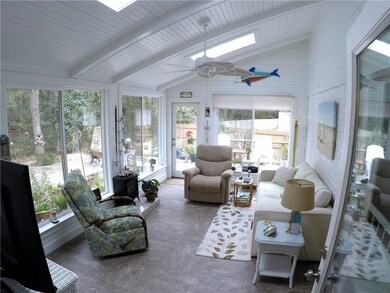 New addition to the home is this enclosed patio ar