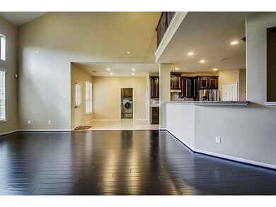 This spacious open-concept living area features da