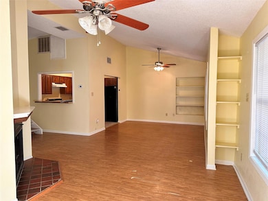 Unfurnished living room featuring ceiling fan, va
