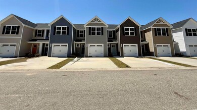 Multi unit property featuring driveway and an atta