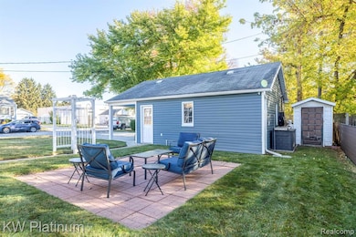 View of patio with an outbuilding
